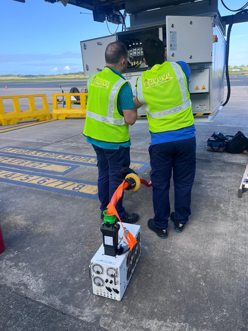 Isivuvu technicians servicing ground support equipment on an airport apron